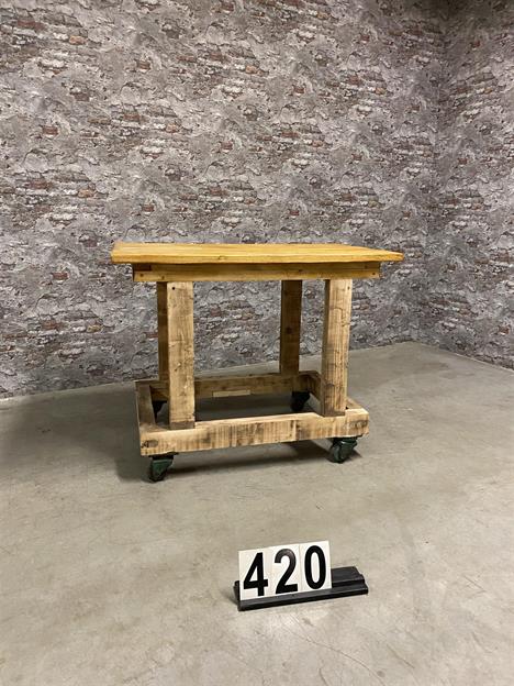 Vintage wooden table on wheels